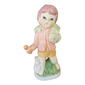 Vintage porcelain figurine child with bunnies